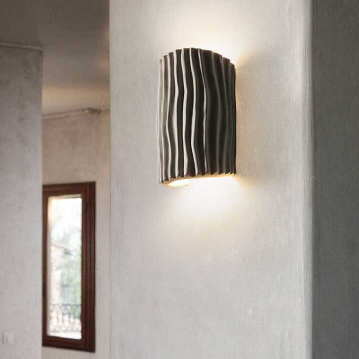 Nordic resin wall light in creamy yellow textured finish
