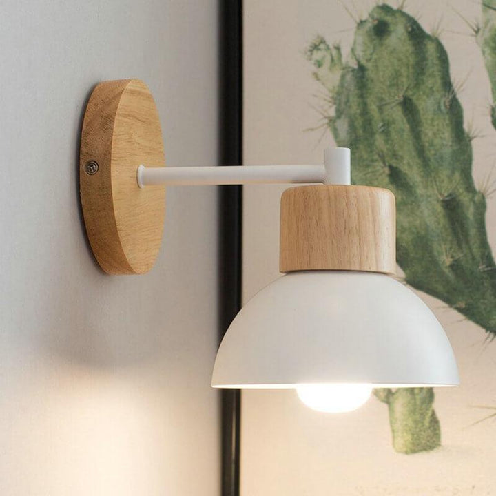 Black Nordic dome wall sconce with solid wood detail