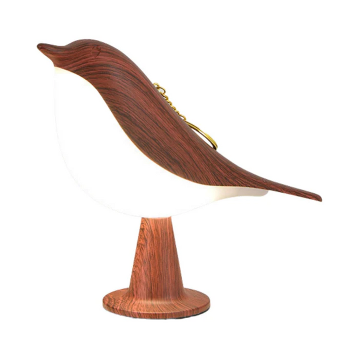 Battery-operated bird night light on a nursery shelf
