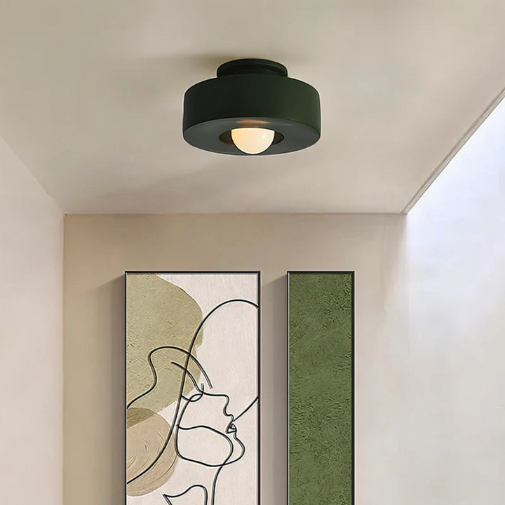 Galini LED ceiling light shown switched on emitting warm white glow