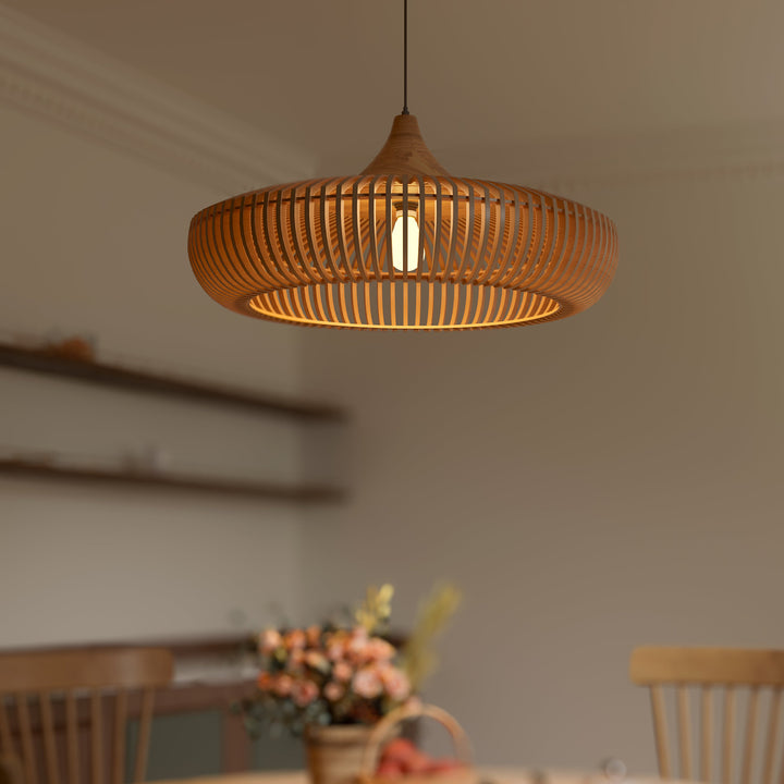 Handcrafted wood pendant light above kitchen island – lit ambient view