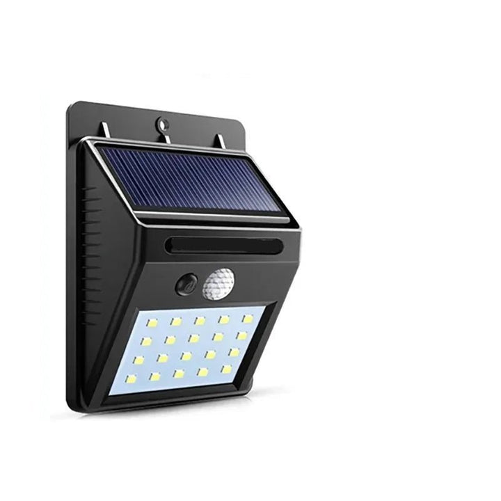 Solar motion sensor LED wall light mounted by a front door, illuminating a path