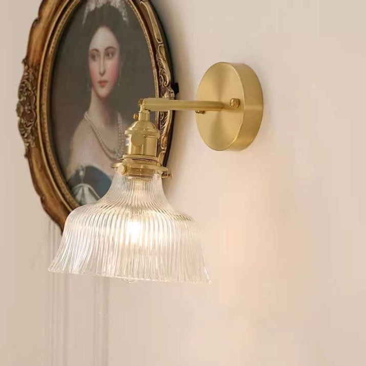 Brass finished Nordic wall light installed in bedroom