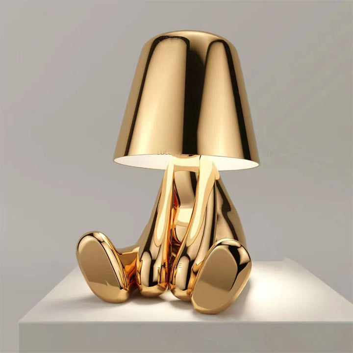 Zoryl elegant gold LED table lamp with warm glow on a console