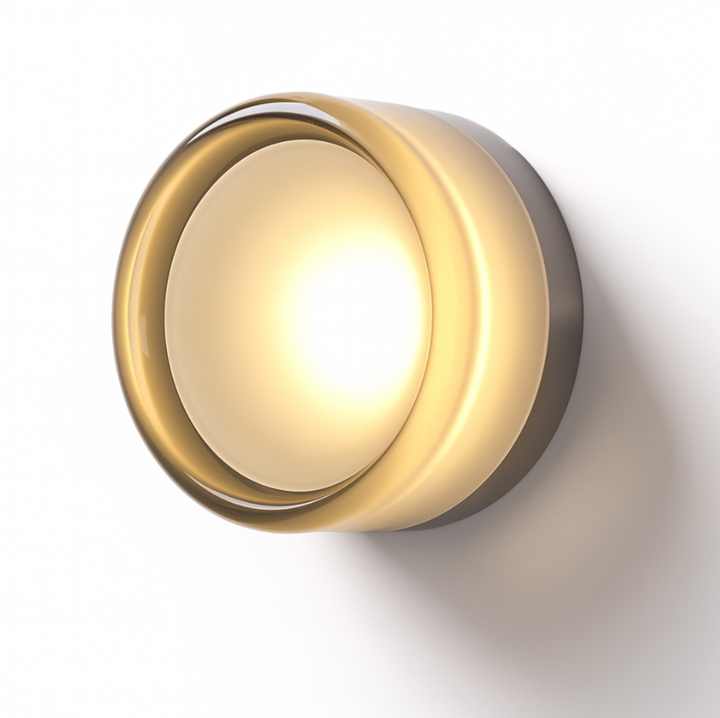Modern round glass LED wall sconce in smoke grey on a feature wall above a console