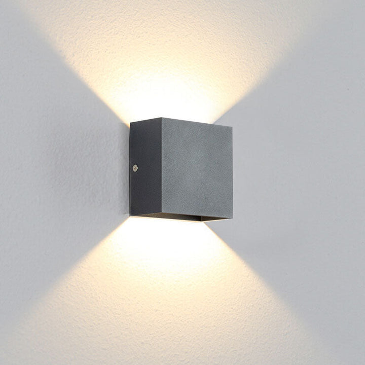 Modern square LED wall sconce installed in hallway