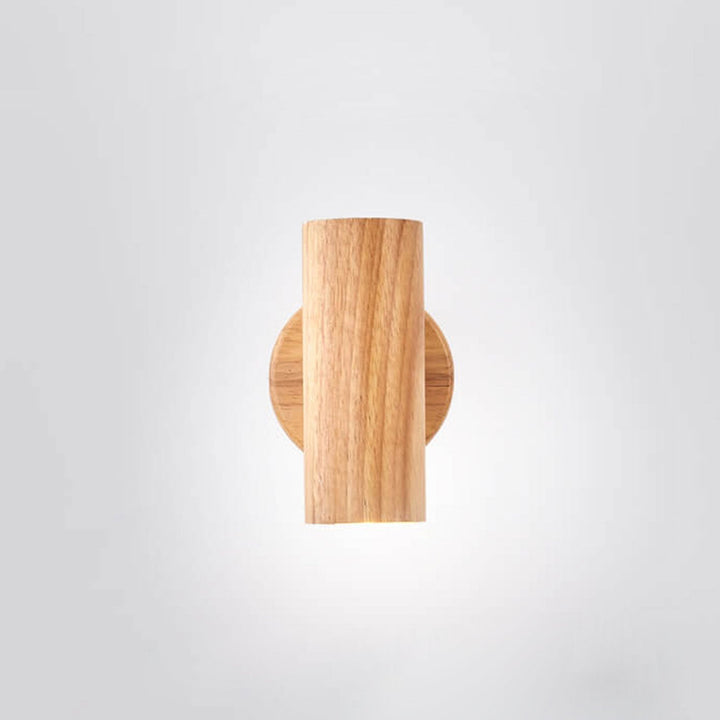 Modern wooden cylinder LED wall light in minimalist room