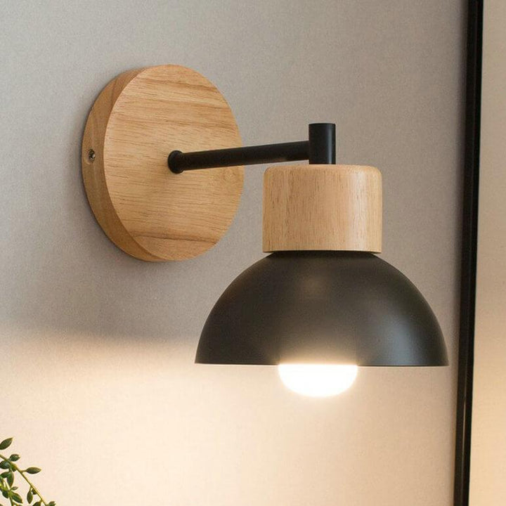 Nordic wood dome wall light glowing softly on bedroom wall