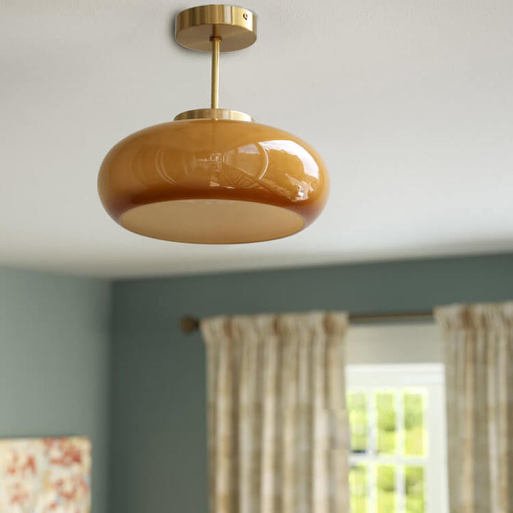 Mid-century amber glass semi-flush ceiling light with brass stem – view 1