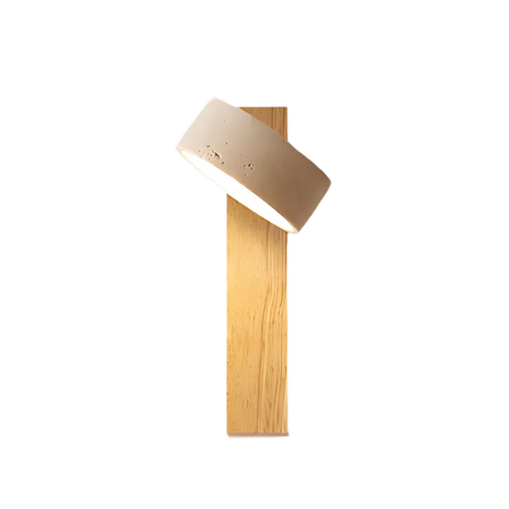 Wabi-sabi travertine and wood LED wall sconce mounted in a minimalist bedroom