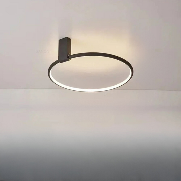 Aurenza ceiling light installed above a modern dining table
