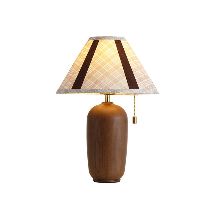 Belvane walnut table lamp with beige fabric shade on console