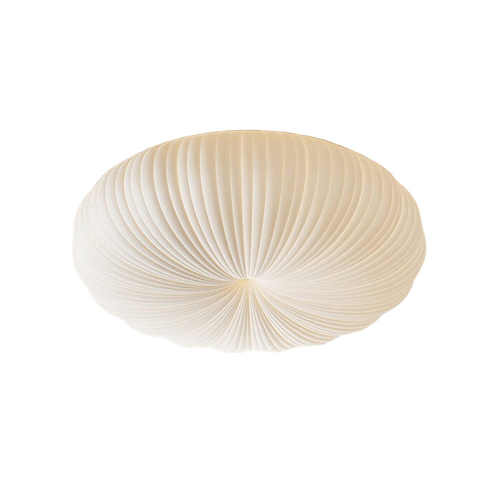 Yavira minimalist acrylic Japandi ceiling lamp glowing softly in a UK living room