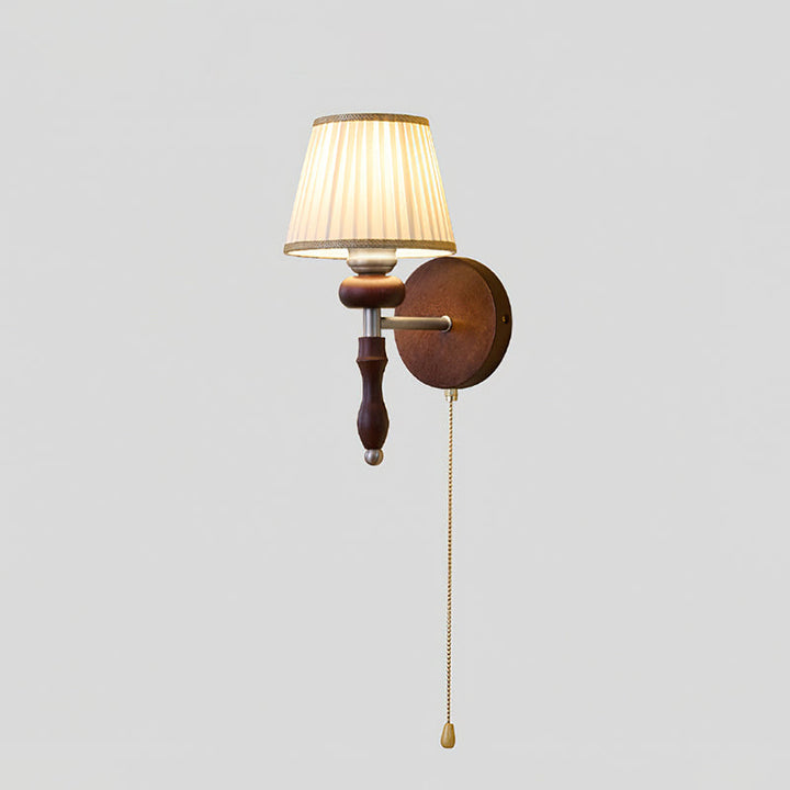 Celine vintage brass wall lamp with adjustable arm beside bed