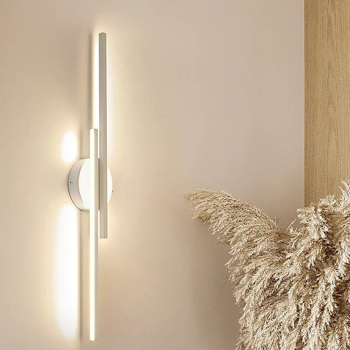 Elysium Wall Lights wall light lit at night, warm ambient glow