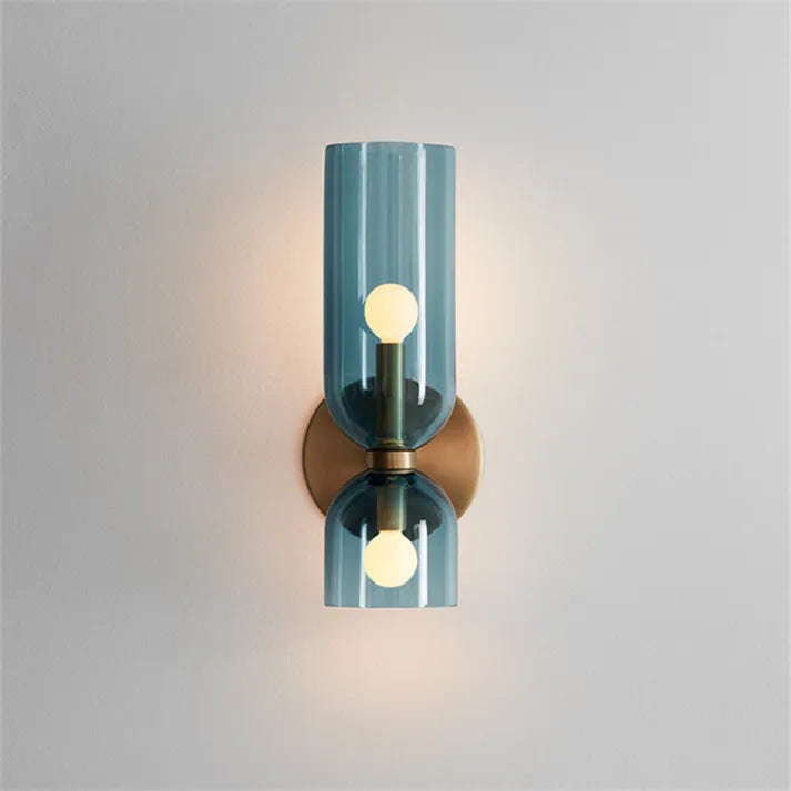 Modern 2-light glass cylinder wall lamp installed in hallway