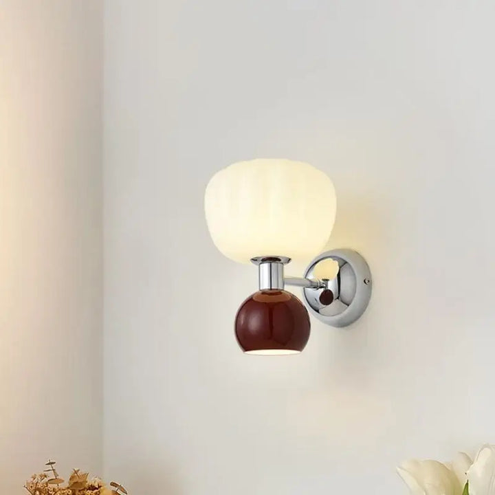 Glass globe 2-light wall sconce in mid-century setting