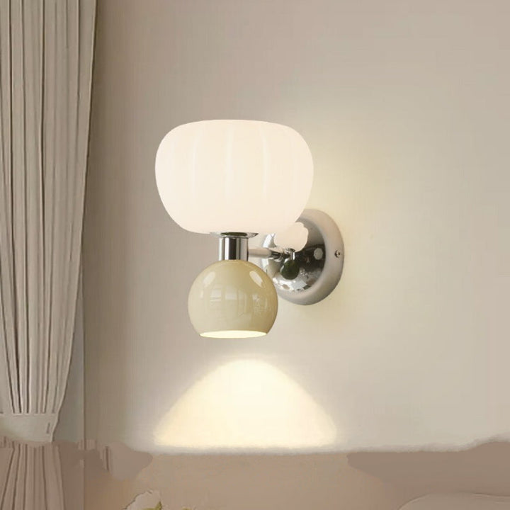 Glass globe wall sconce white variant in modern hallway