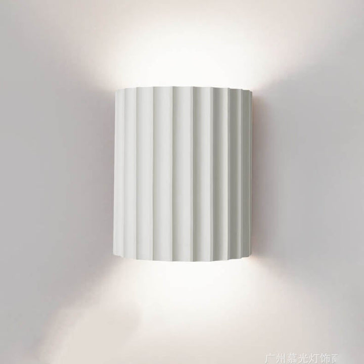 Modern half cylinder wall sconce lamp hero shot in white