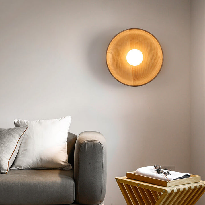 Wood round wall light medium size installed bedside