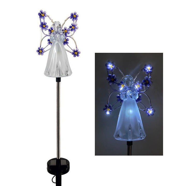 Decorative angel LED stake light in memorial garden setting