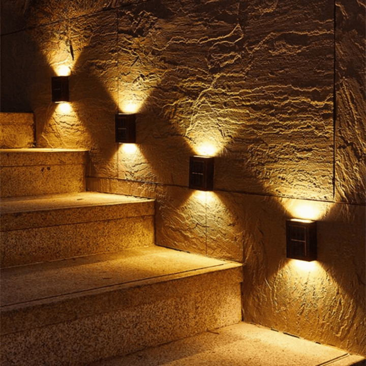 Slim square wall-mounted solar light beside a patio doorway