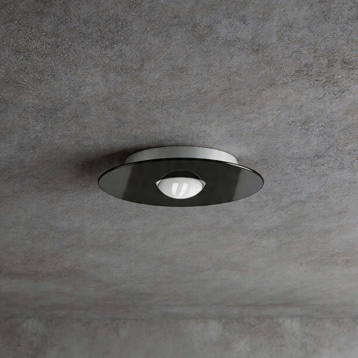 Veluné ceiling lamp installed in living room with warm ambient light