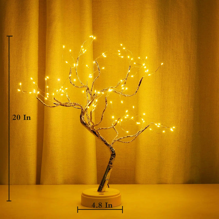 Auralyn LED bonsai lamp with bendable branches lit at night