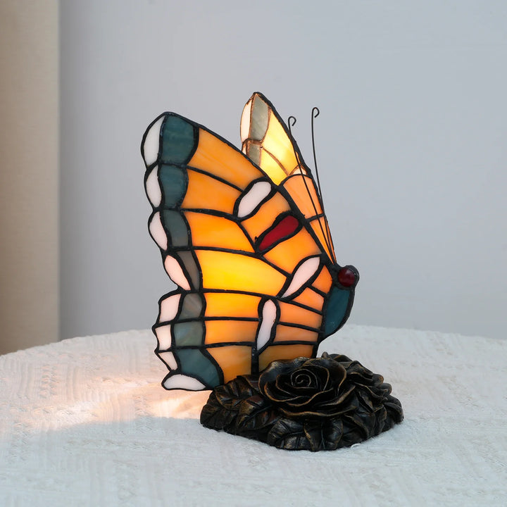 Zyrelis Tiffany-style butterfly bedside lamp glowing warmly