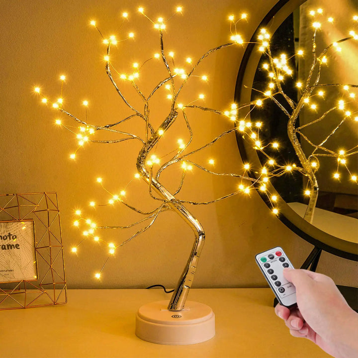 Auralyn 108 LED bonsai table lamp glowing on a desk