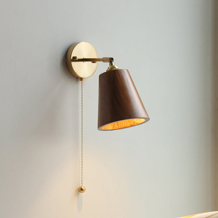 Scandinavian brass wood wall sconce in reading nook