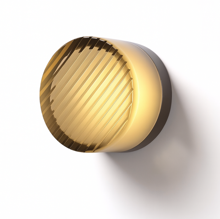 Aluminium-body glass wall sconce close-up showing the refracted LED light