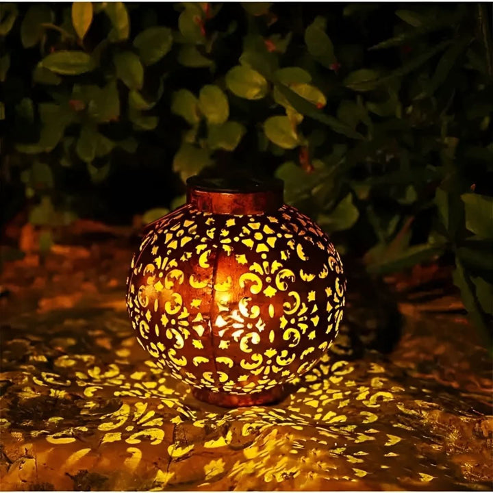 Vintage solar globe garden lantern hanging from a shepherd&