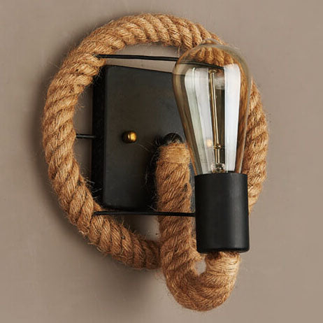 Round rope wall light installed in farmhouse entryway