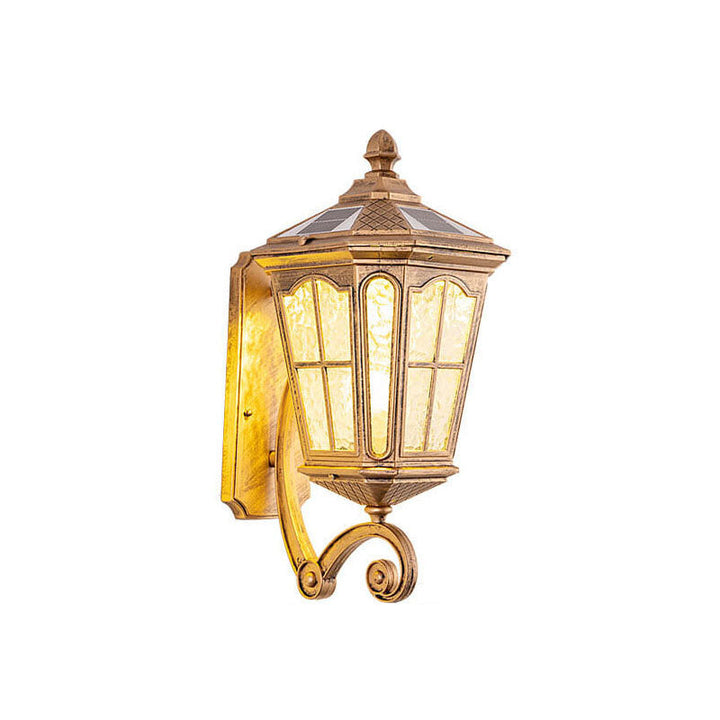 Bronze solar outdoor wall lantern illuminating a patio at dusk