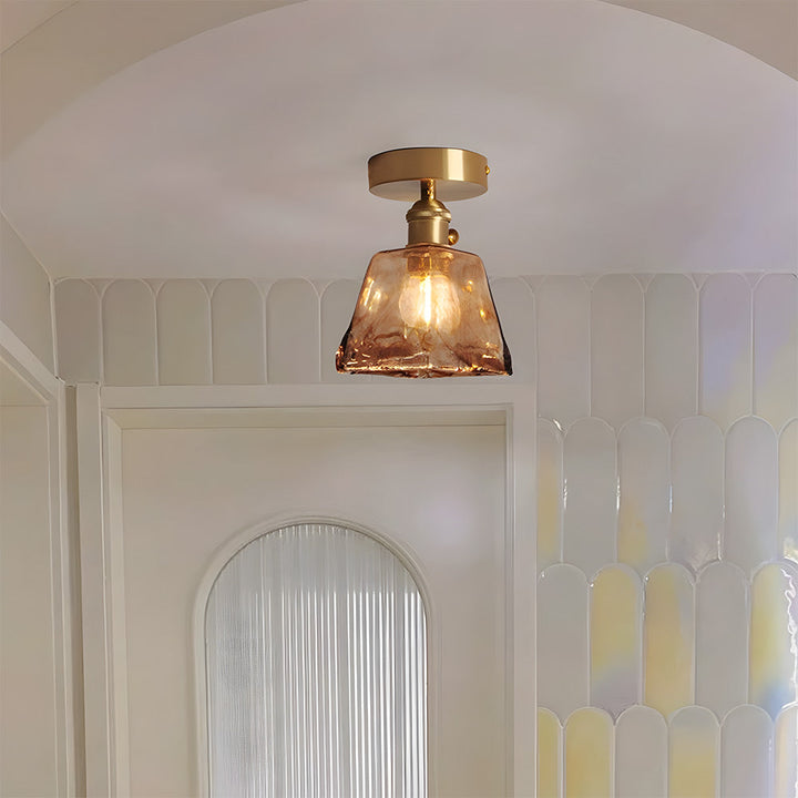 Vluro vintage brass and glass ceiling lamp with warm amber glow in UK living room