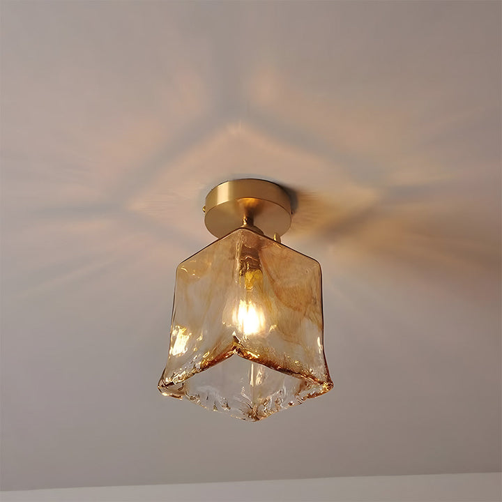 Vluro ceiling lamp close-up of brass fitting and textured glass shade