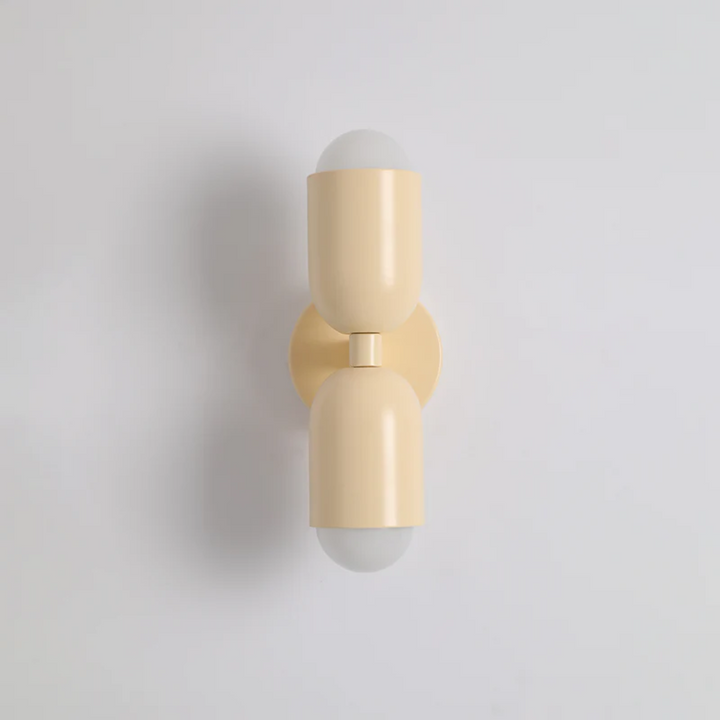 Black-green double-sided LED cylinder wall sconce close-up