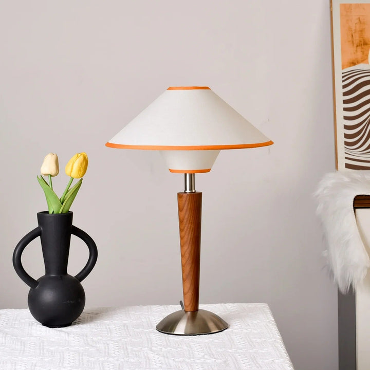 Orona conical fabric shade table lamp lit on living room sideboard