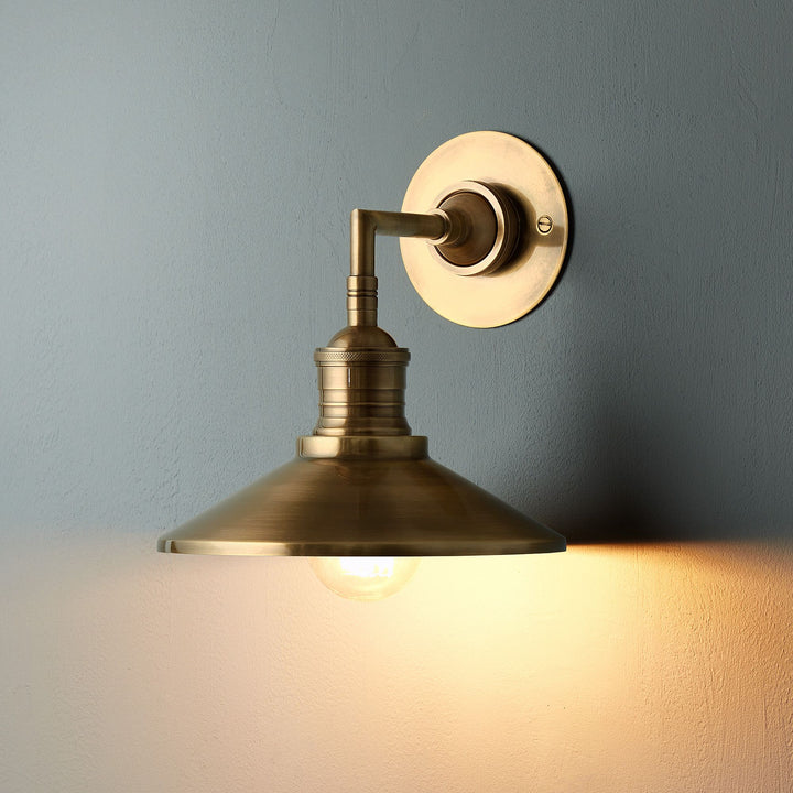 Whizzer wall light side profile in antique brass